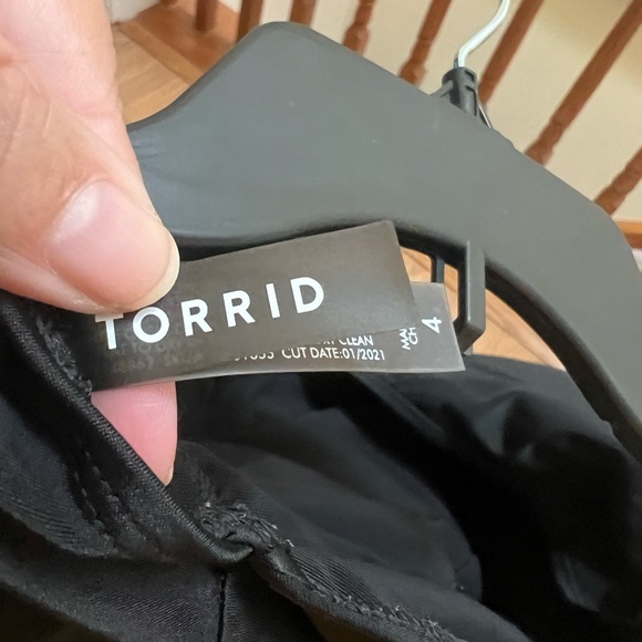 Black swimsuit by torrid with ruching and feminine hemline. Worn once - Picture 3 of 3